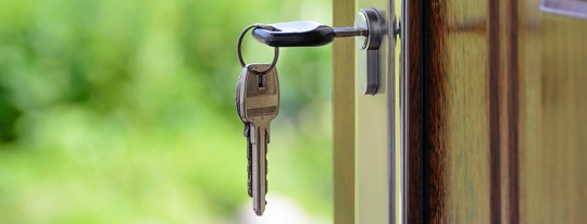 keys hanging from the lock of a door