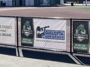 Banner on fence with Gullotta logo